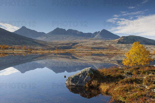 Digerronden reflected in water of lake in autumn