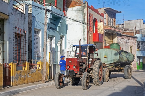 Tractor with trailer for emptying septic tanks