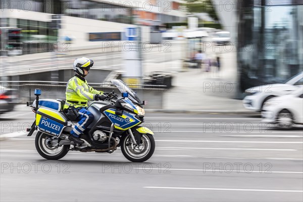 Police motorbike at night in front of urban environment