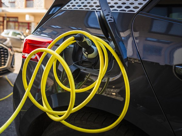 An e-car charges at a public charging station in Duesseldorf