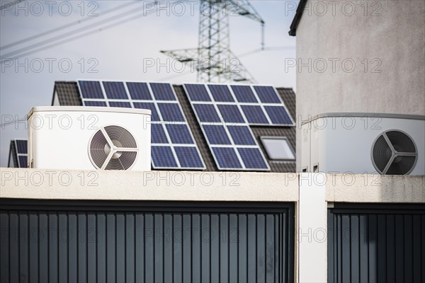 Heat pump on a garage roof of a new development