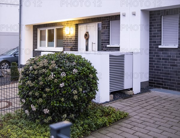 Heat pump in the front garden of a terraced house in Langenfeld