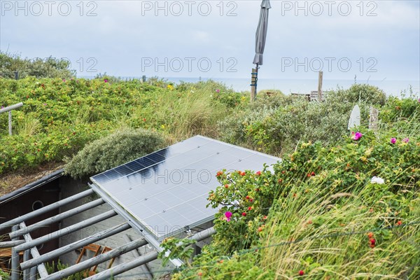 Solar panel above a former bunker of the German Wehrmacht on the North Sea island of Terschelling