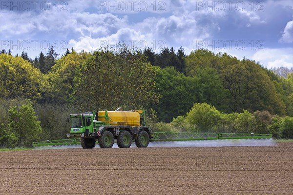 Farmer spraying pesticides