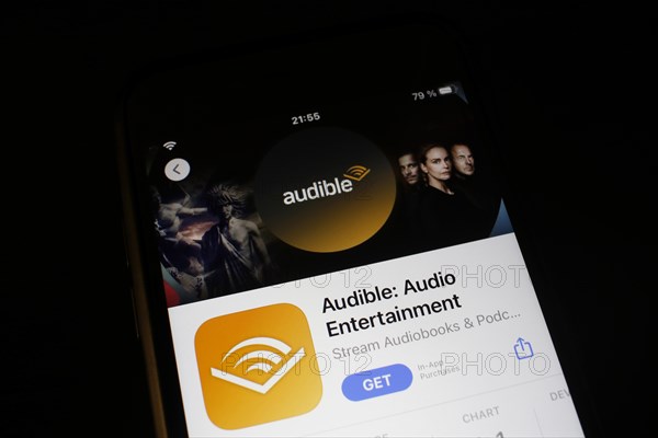 Detailed view of a smartphone with Audible app in the iPhone App Store