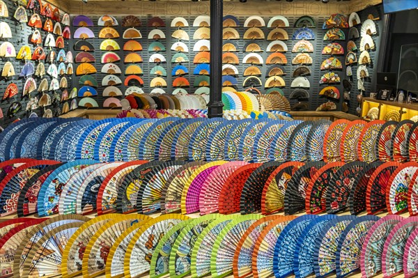 Colourful fans in a shop window in Seville