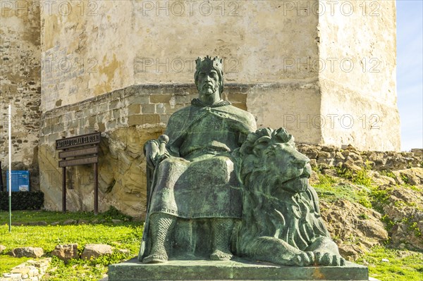 The monument to King Sancho IV El Bravo in front of Guzman Castle in Tarifa