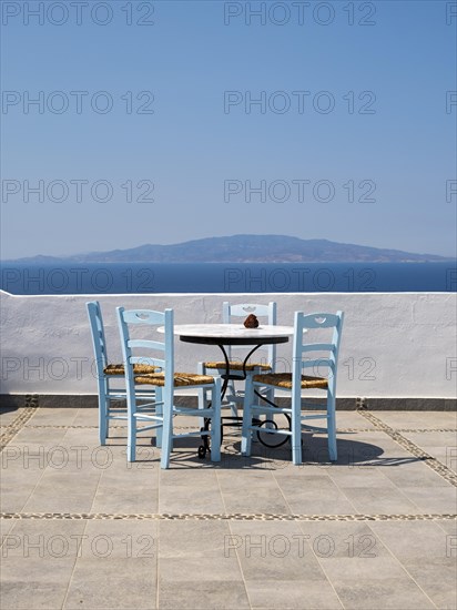 Sea view from terrace with chairs and table