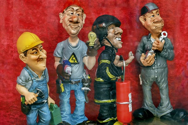 Shop window with funny ceramic figures of different professions