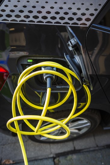 An e-car charges at a public charging station in Duesseldorf