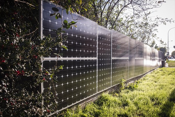 Solar panels as a garden fence and privacy screen of a house on a street in Langenfeld