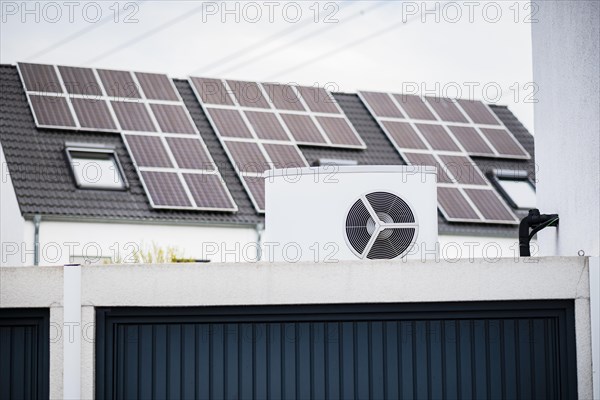 Heat pump on a garage roof of a new development