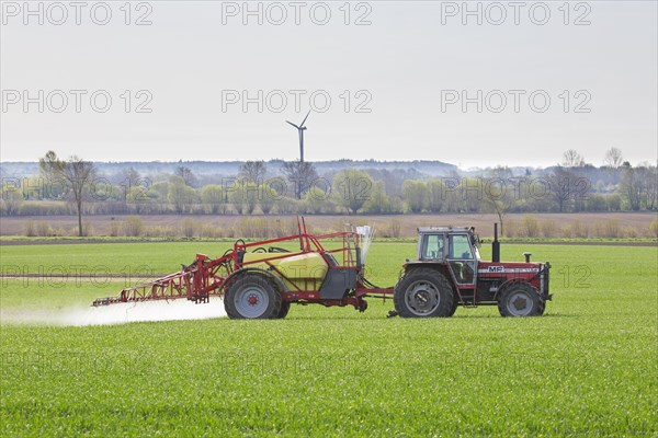 Farmer spraying pesticides