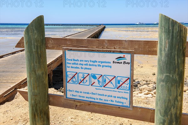 Prohibition sign Mandatory sign for tourists Beach holidaymakers with warning Prohibition of pollution Throwing away rubbish Rubbish destruction Walking on coral Reef top of coral reef