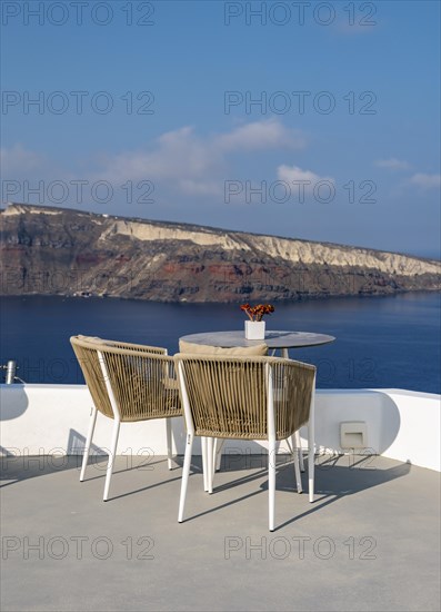 Sea view from terrace with chairs and table