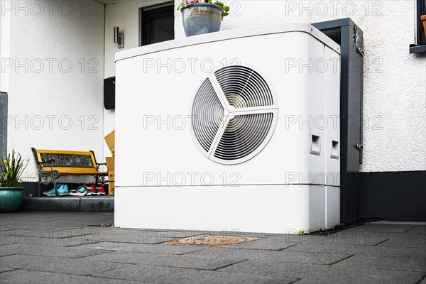 Heat pump in the front garden of a terraced house in Monheim am Rhein