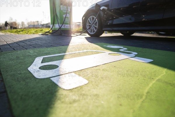 An e-car charges at a public charging station in Duesseldorf