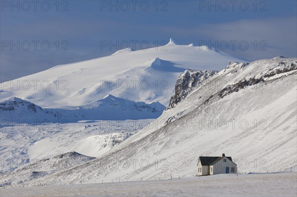 Lonely house in desolate landscape in the snow in winter on the Snaefellsnes peninsula in Iceland