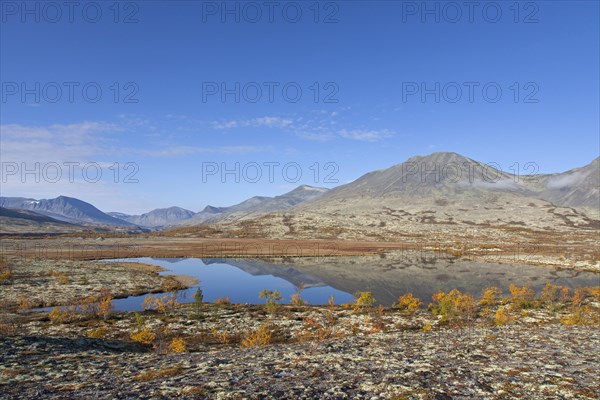 Lake in front of the mountain Stygghoin in autumn