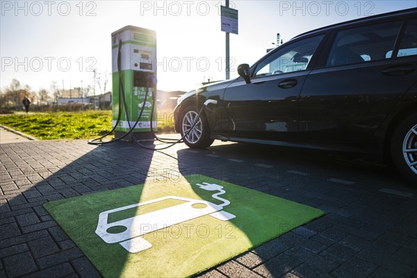 An e-car charges at a public charging station in Duesseldorf