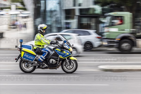 Police motorbike at night in front of urban environment