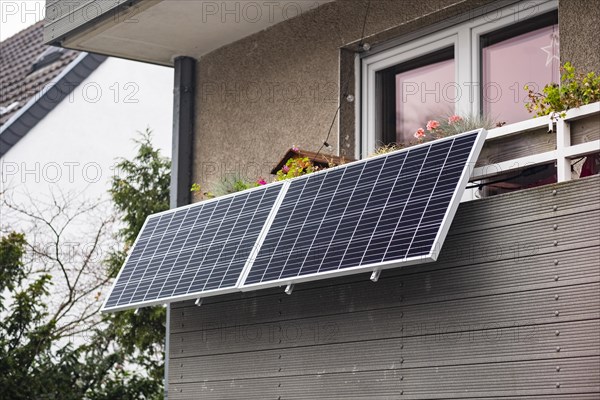 Balcony power plant made of solar panels on a house in Duesseldorf