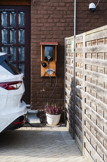 A car being charged at a public charging station