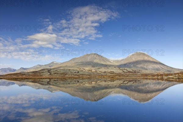 Stygghoin reflected in water of lake in autumn
