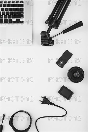 Overhead view camera accessory with laptop white background