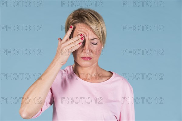 Portrait woman holding his head pain