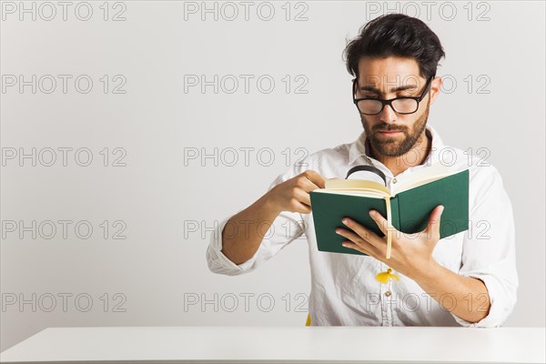 Businessman looking information book