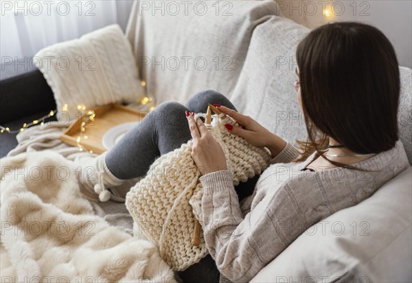 Woman with knitting tools