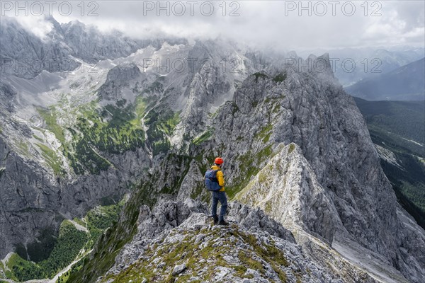 Mountaineer at the summit of the Waxenstein