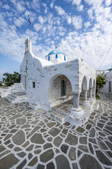 White Greek Orthodox Church Holy Church of Agios Konstantinos with Greek flag