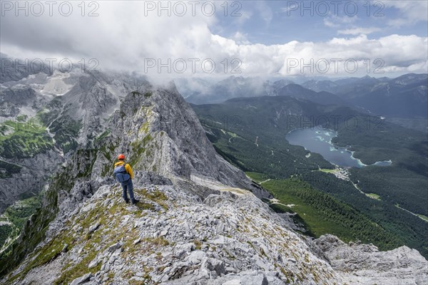 Mountaineer at the summit of the Waxenstein