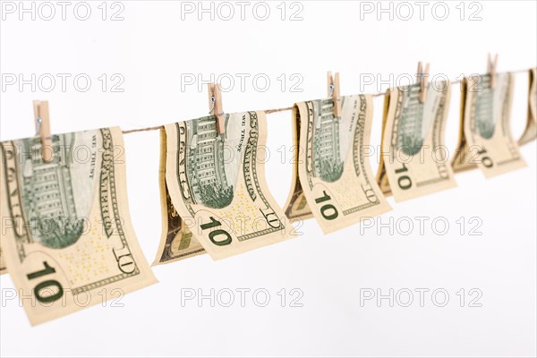 Side view banknotes hanging clothesline