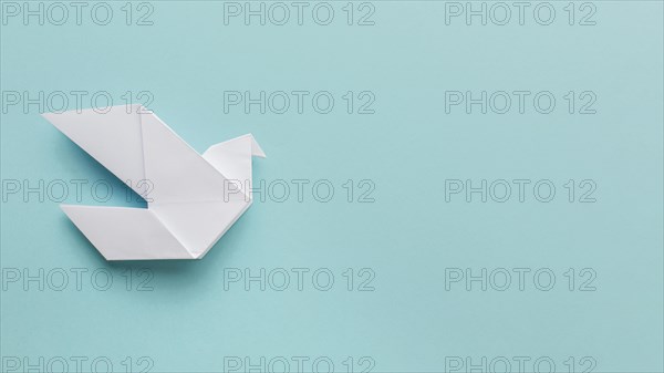 Flat lay paper dove with copy space