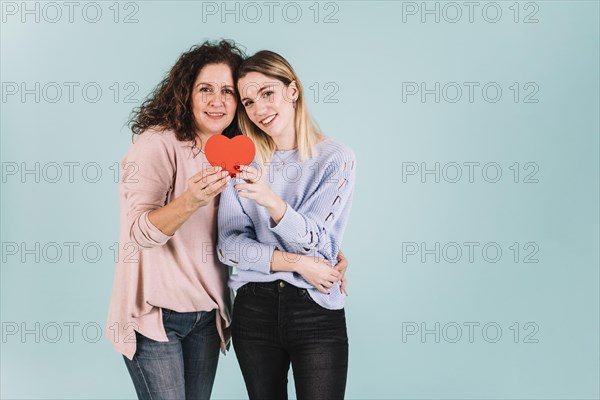 Cute mother daughter with heart