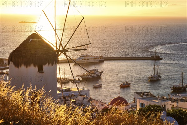 Golden sunset over sea horizon in Mykonos