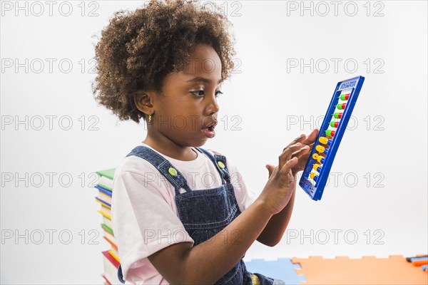 Cute kid with abacus studio