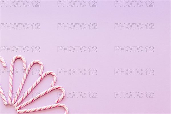 Design made with xmas candy cane pink background corner