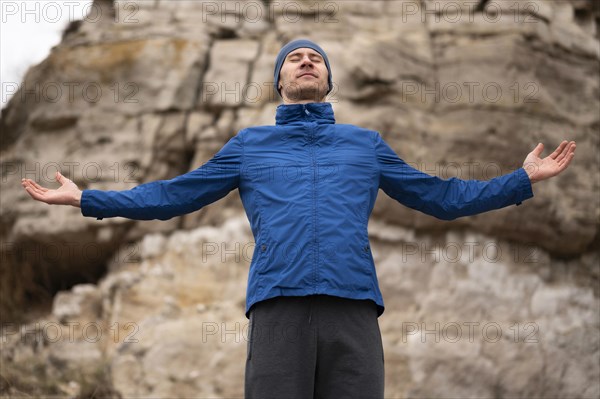 Man standing nature with arms open