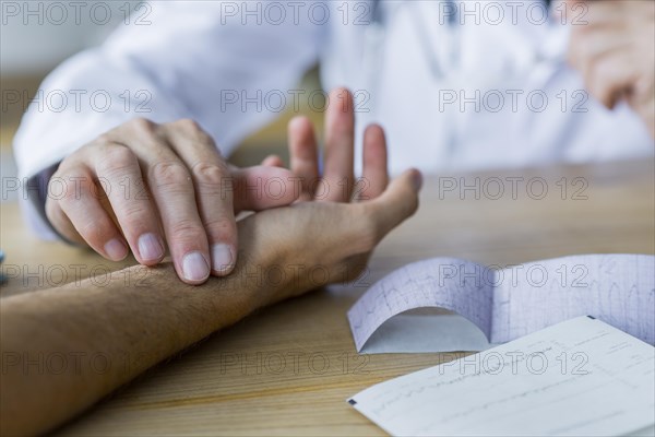 Crop doctor checking pulse patient