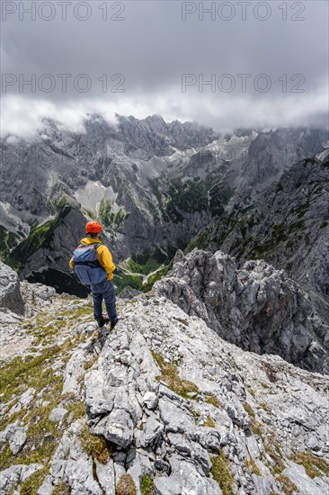 Mountaineer at the summit of the Waxenstein