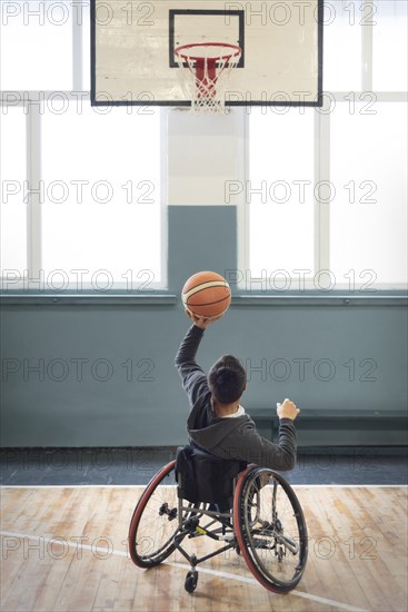 Full shot man playing basketball