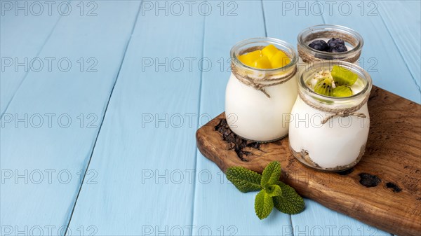 Assortment delicious breakfast meal with yogurt