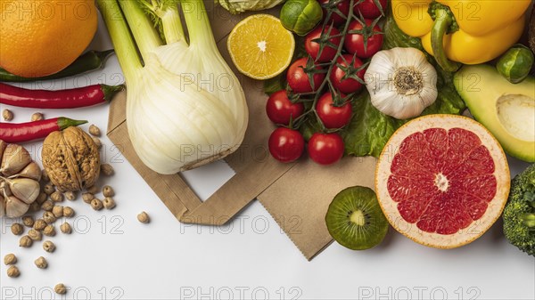 Flat lay assortment vegetables with paper bag copy space