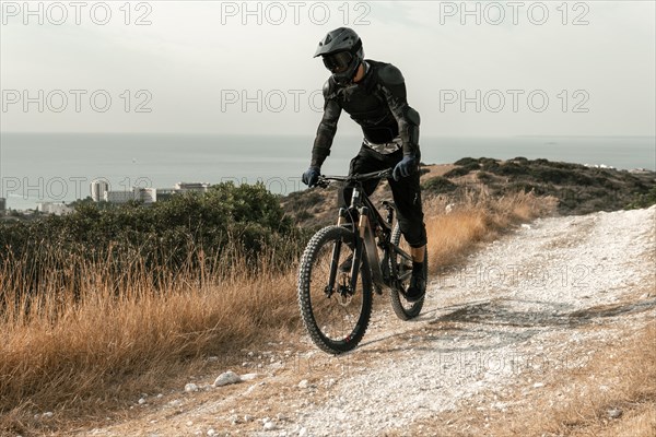 Man mountain biking equipment riding his bike