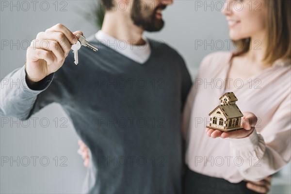 Crop couple with keys house