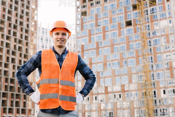 Front view smiley man with hands hips